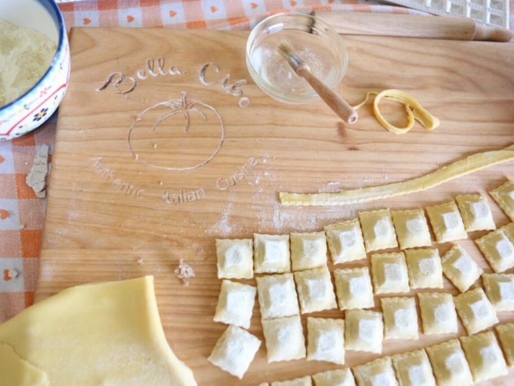 Homemade pasta on a wooden chopping block counter - pasta making is a class at Posh Pantry