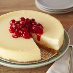 Cheesecake with cooked cherries on top