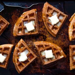 waffles with square of butter on top for recipe